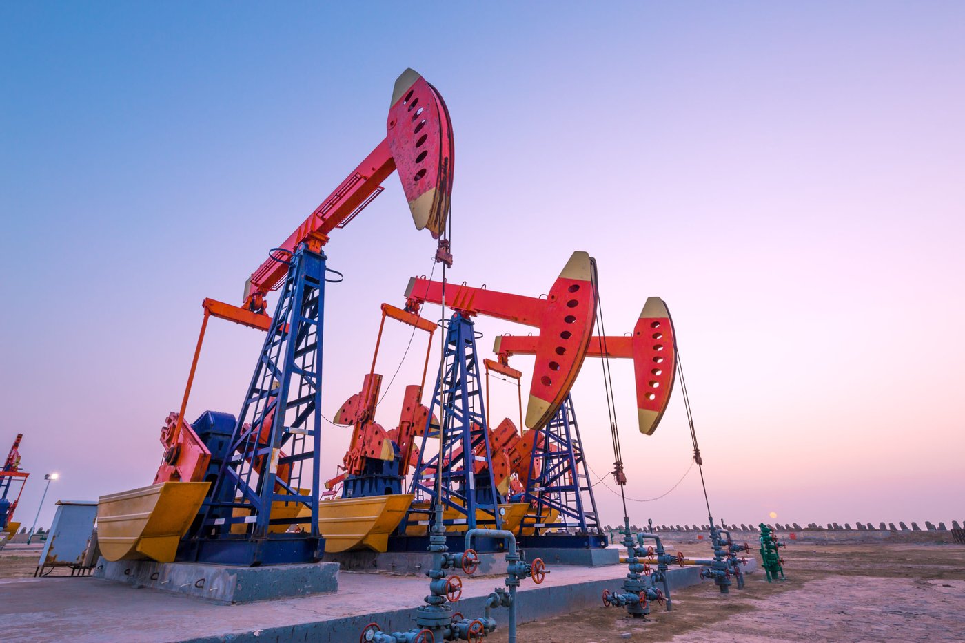 Oil field pump jacks at sunset